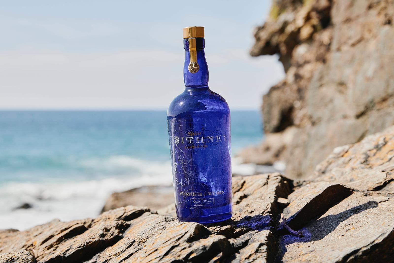 Sitheny Bottle On Rock With Cliff