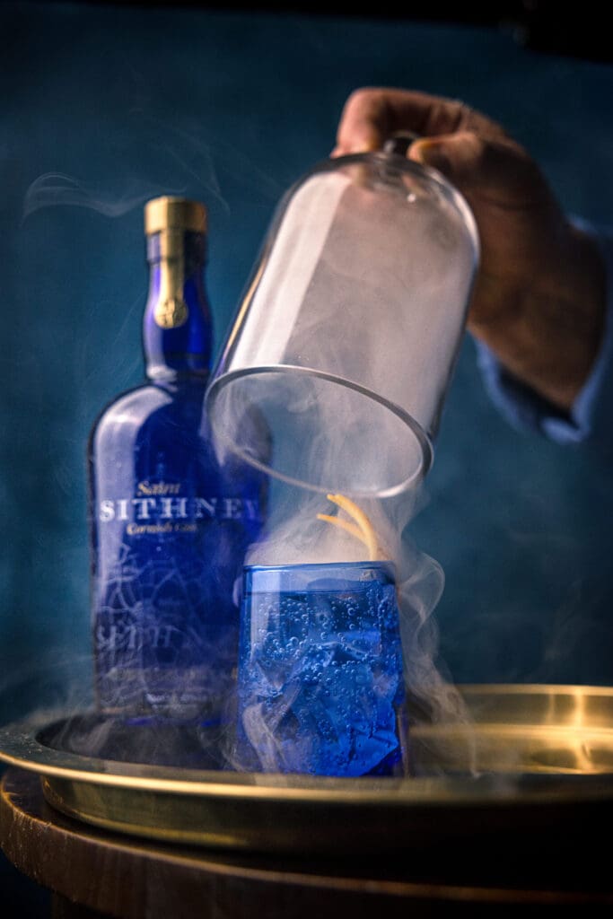 Sithney Bottle In Background With Smoke Over Glass