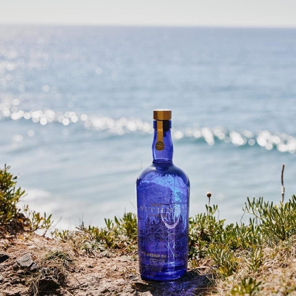 Sithney Bottle On Rock With The Sea In The Background
