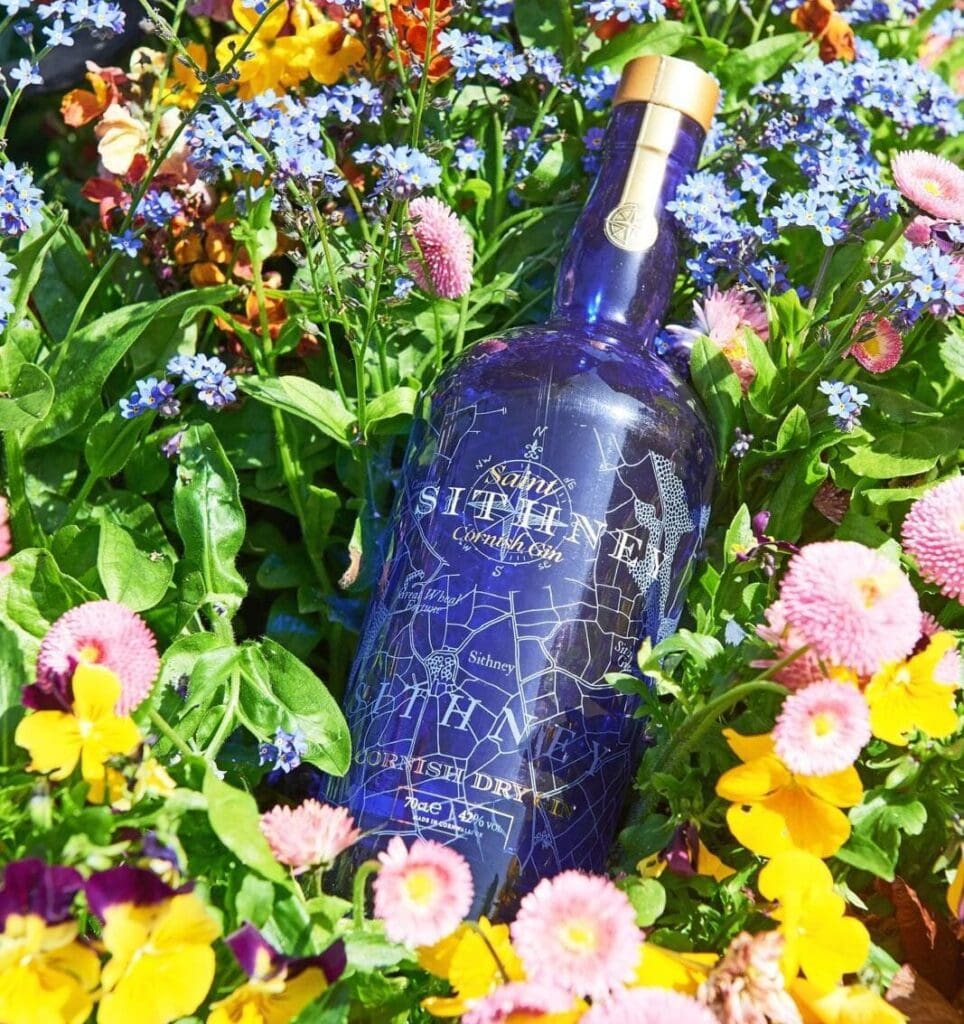 Sithney Closup Bottle In Field With Flowers